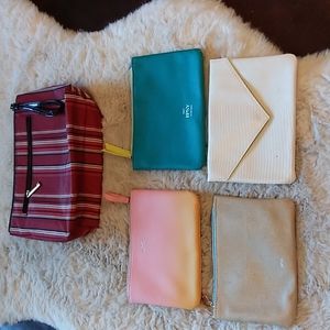 VGUC. One large cosmetic bag striped with zipper down the front for ipsy…